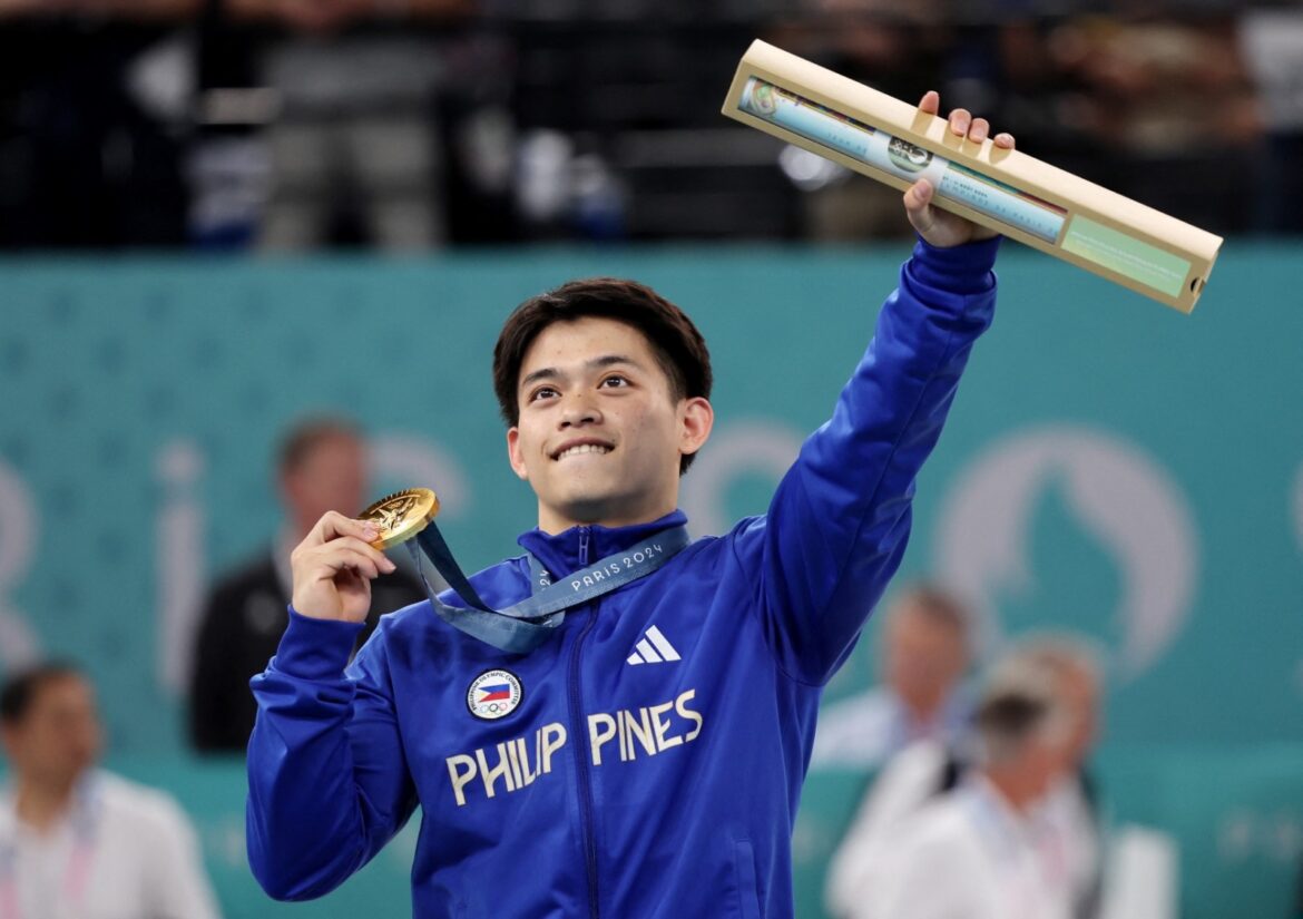 Carlos_Yulo_Gold_Medalist_in_Olympics Gymnast Carlos Edriel Yulo of Philippines celebrates after his men's floor exercise performance in the 2024 Paris Olympics. Hannah Mckay / Reuters