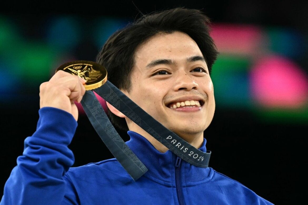 Philippines' Carlos Edriel Yulo poses with his gold medal during the podium ceremony for the artistic gymnastics men's vault event of the Paris 2024 Olympic Games at the Bercy Arena in Paris, on August 4, 2024. Lionel Bonaventure, AFP